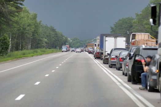 Many cars stopping in one directions. Europe road.
