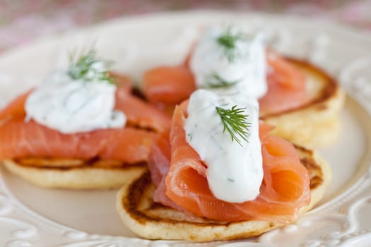 Small pancake with salmon and sourcream and dille