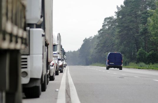 Many cars stopping in one directions. Europe road.
