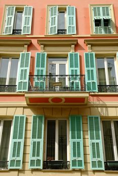 Street view of typical pastel colored house at the Cote d'Azur with mediterranean appeal.