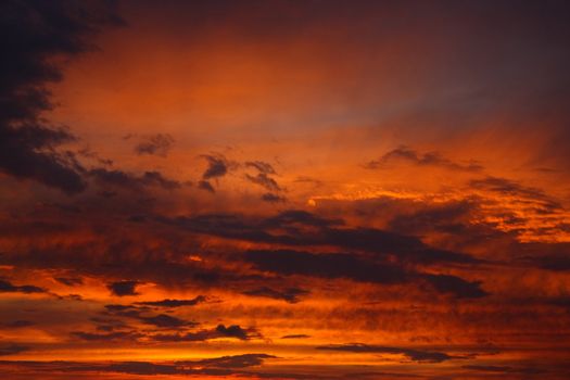 Clouds and sunset rays in the sky.