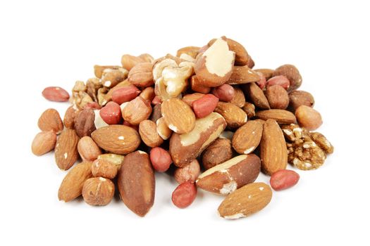 Assorted mixed nuts on a reflective white background