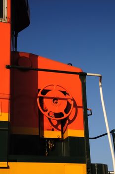 Detail of red and orange locomotive car.
