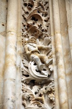 sculpture of astronaut in salamanca cathedral wall