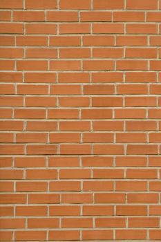 front view of red bricks wall with concrete