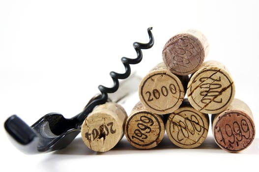 Corkscrew and corks with year stamp as pyramid