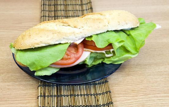 yummy sesame baguette with turkey, cheese, lettuce and tomatoes