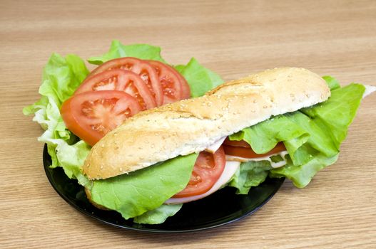 delicious and fresh sesame baguette with turkey, cheese, lettuce and tomatoes