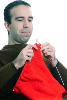 Closeup view of a man knitting, isolated against a white background