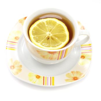 Cup of tea with lemon over white background