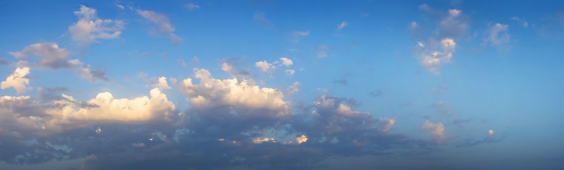 Panaromic view of clouds of a beautiful summer sky. It is almost sunset.