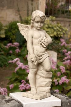 Stone angel statue in an old catholic cemetery