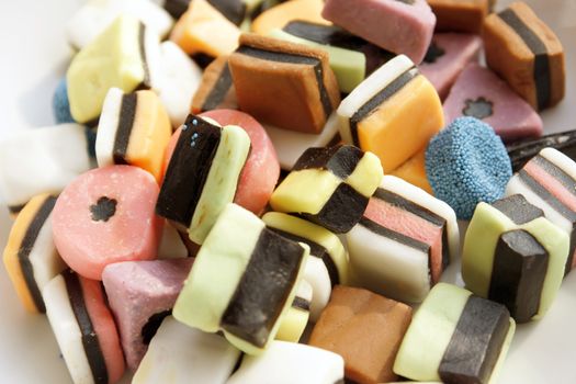 Close-up of some colored allsorts liquorice candies