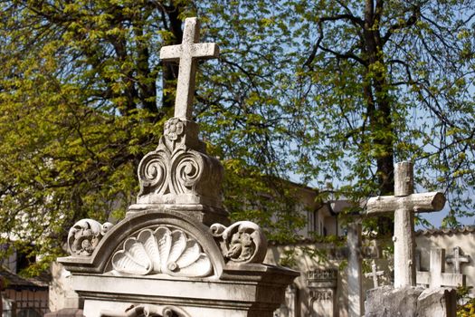 Stone graves in an old catholic cemetery