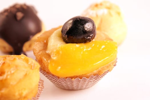 Close-up of some assorted delicious tea cakes isolated on white