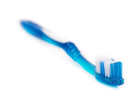 A toothbrush isolated against a white background