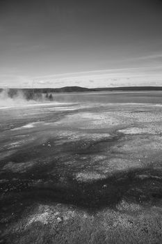Geothermal hot springs on the shore of Yellowstone Lake in Black and White
