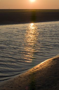 sunrise on the beach on ameland, the netherlands