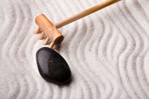 An oriental rock garden background with stones and sand