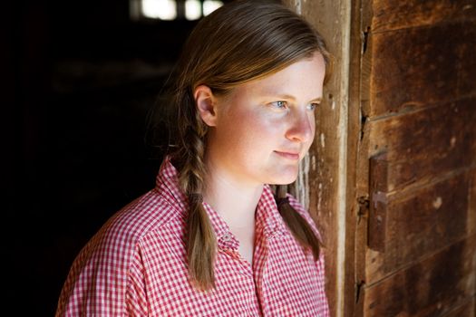 A farm girl worker taking a break