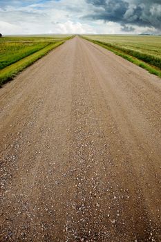 A prairie storm and a gravel road