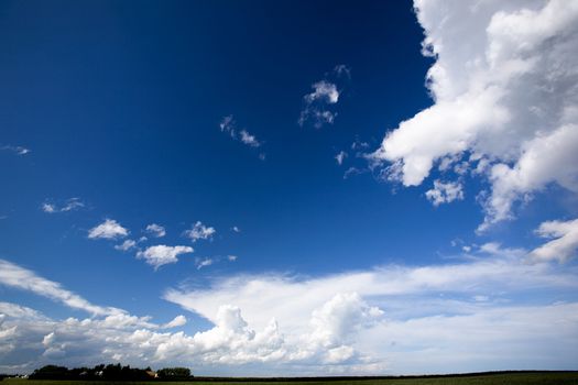 A landscape with a big sky with clouds