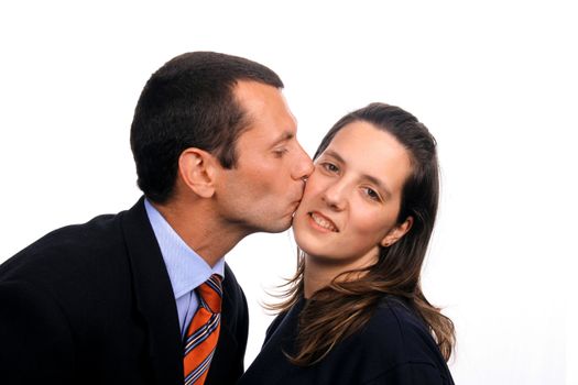 businessman kissing casual woman over white background