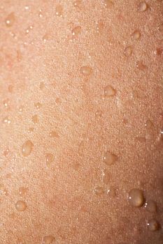 A detail image of water drops on skin