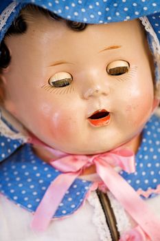 A close up of a doll face - focus on the eyes