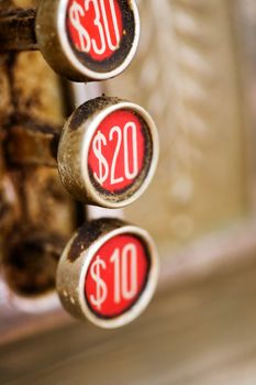 A 20 button on a retro dirty cash register - shallow depth of field