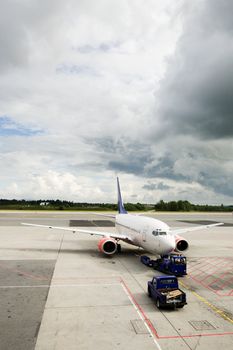 An airplane at the airport on the tarmac