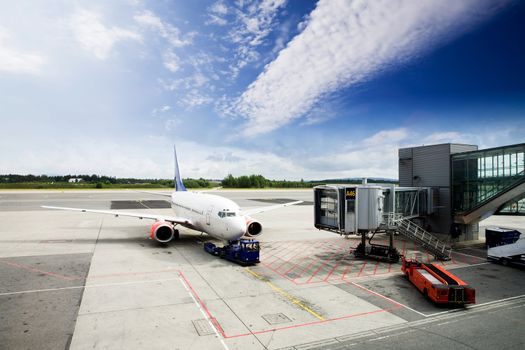 An airplane at the airport on the tarmac