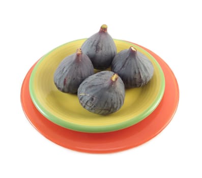 image of a few figs on a yellow plate