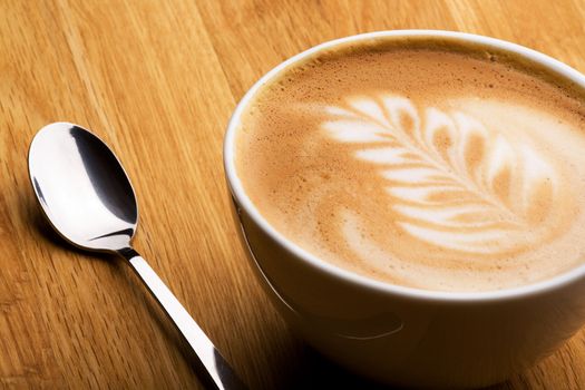 A cappuccino in a bowl with latte art