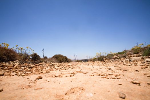 An old dirt road with a deep blue sky