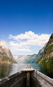 An old boat on a majestic norwegian fjord