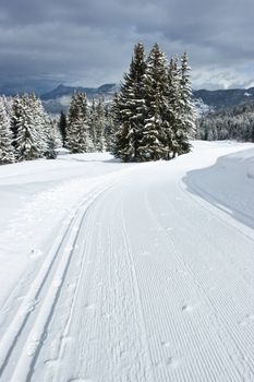 Freshly groomed empty cross-country ski track at French Alps