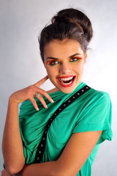 smiling girl posing in a green dress with glasses