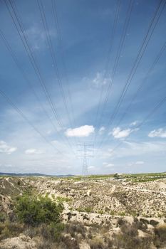 big electric tower with cables at the countrysise in spain