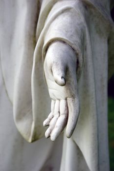 Detail friom a stone hand with dark background