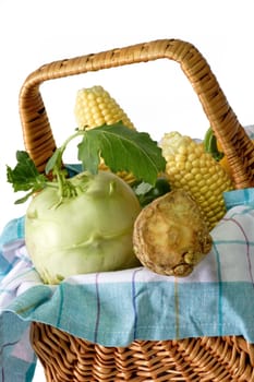 Fresh vegetable in a basket on bright background