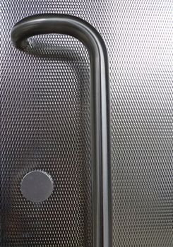 Detail from a metallic steelt door with pattern