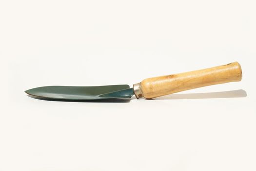 Garden trowel from side against white background