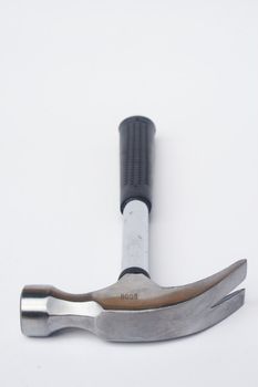 Black handled claw hammer against white background