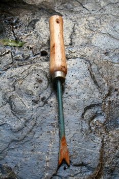 Garden fork on wet stock background