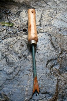 Garden fork on wet stock background