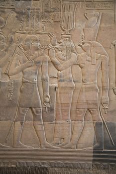 egyptian gods in a temple's wall