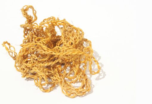 A tangled ball of twine on white background copy space on right