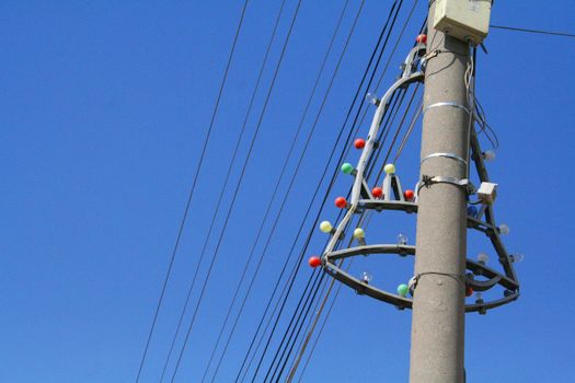 Christmas lights in shape of bell on electrical pole