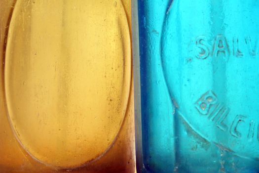 Close-up of yellow and blue seltzer bottles